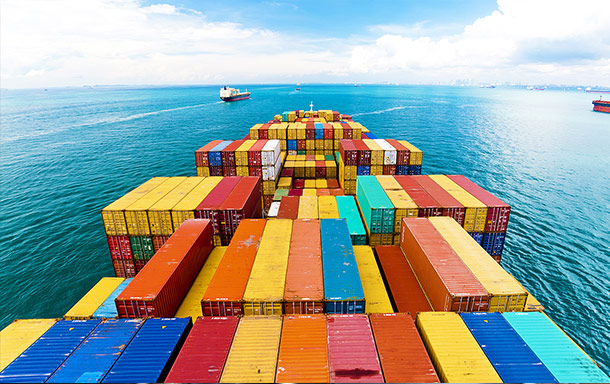 shipping containers on an oceanline shipping freighter travelling across the ocean