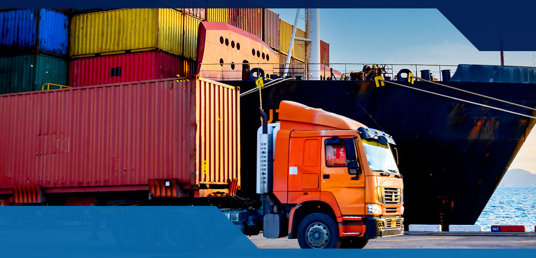 An orange truck hauls a cargo box